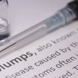 Mumps Definition with Vaccine Needle and Vial