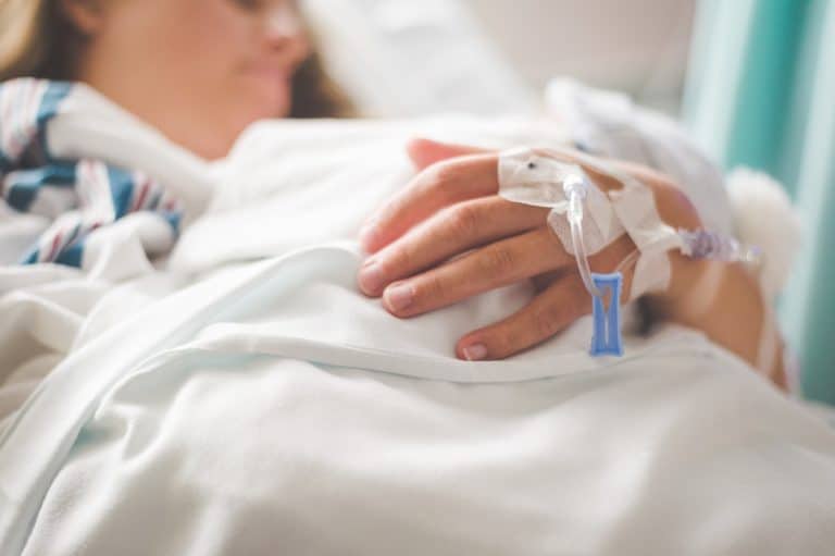Woman in the hospital receives IV medication