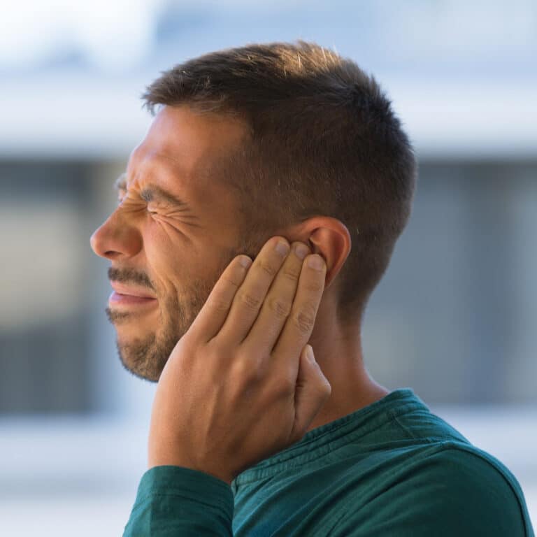 Man Experiencing Tinnitus