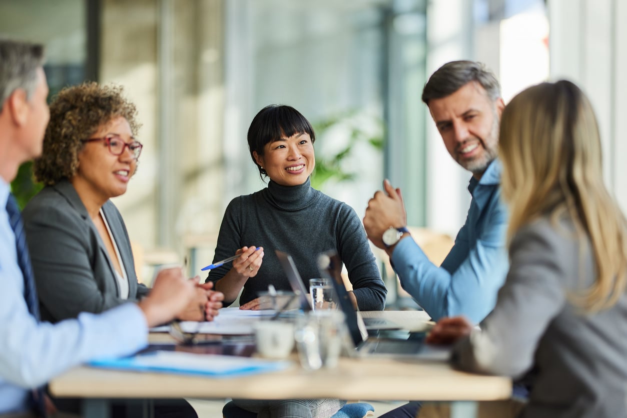 Group of happy coworkers having a productive meeting. 